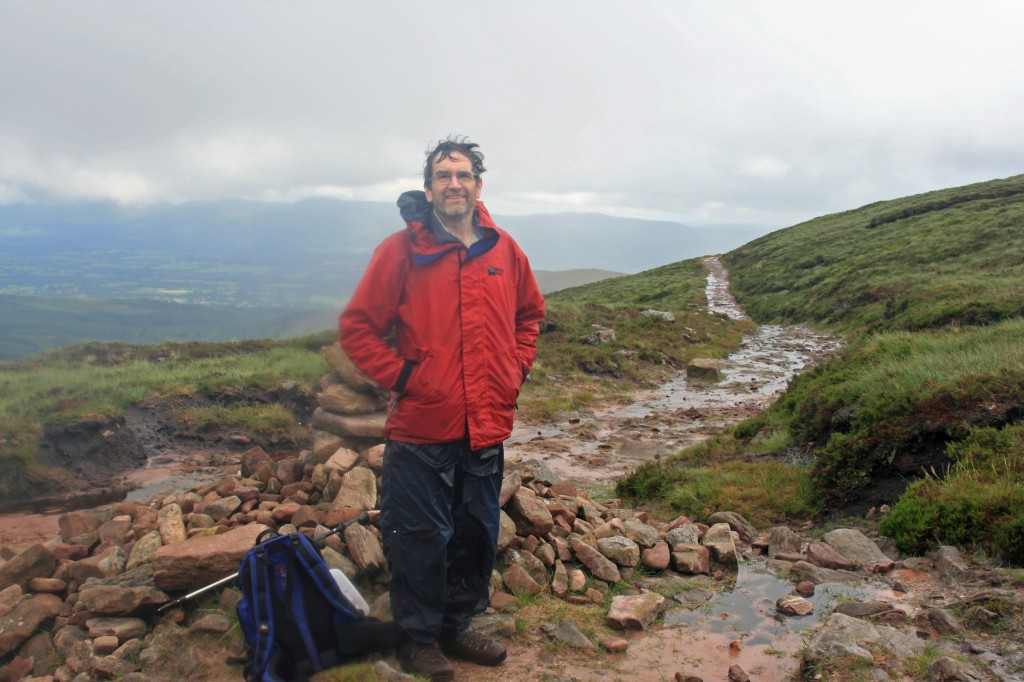 damp, but smiling at the top of the "black road"