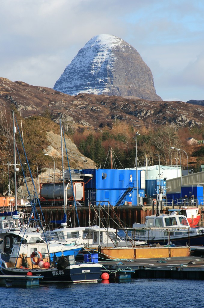 Suilven's crazy summit looms above Lochinver harobour