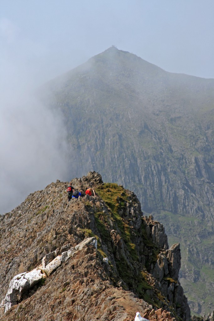 along the ridge of Crib Goch, with Yr Wyddfa the dramatic backdrop