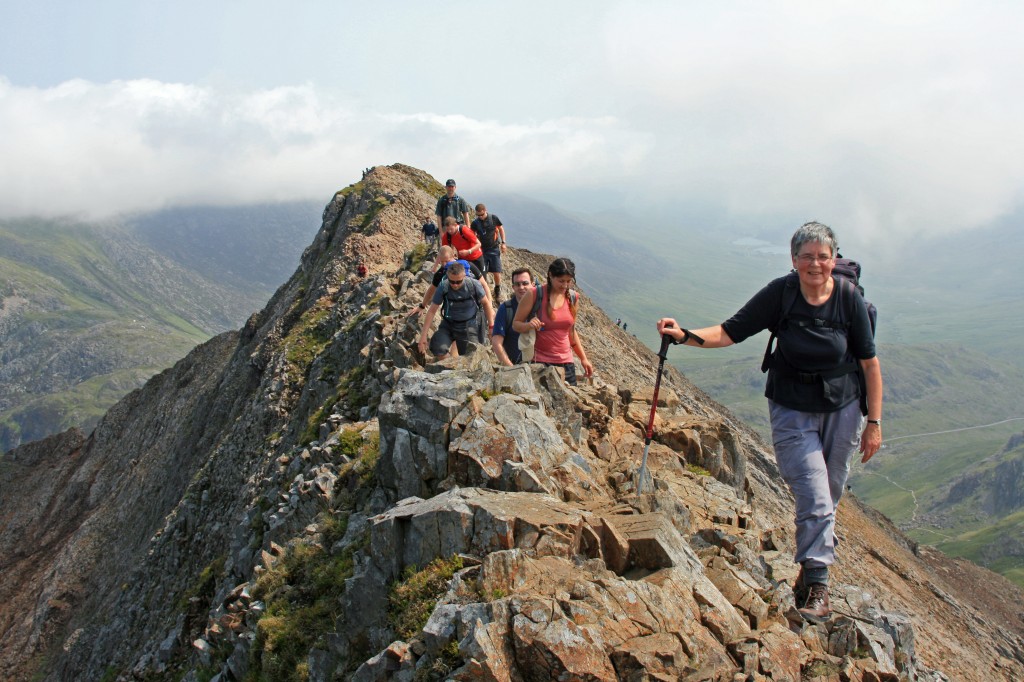 Anne makes her way along the ridge;  summit of Crib Goch behind