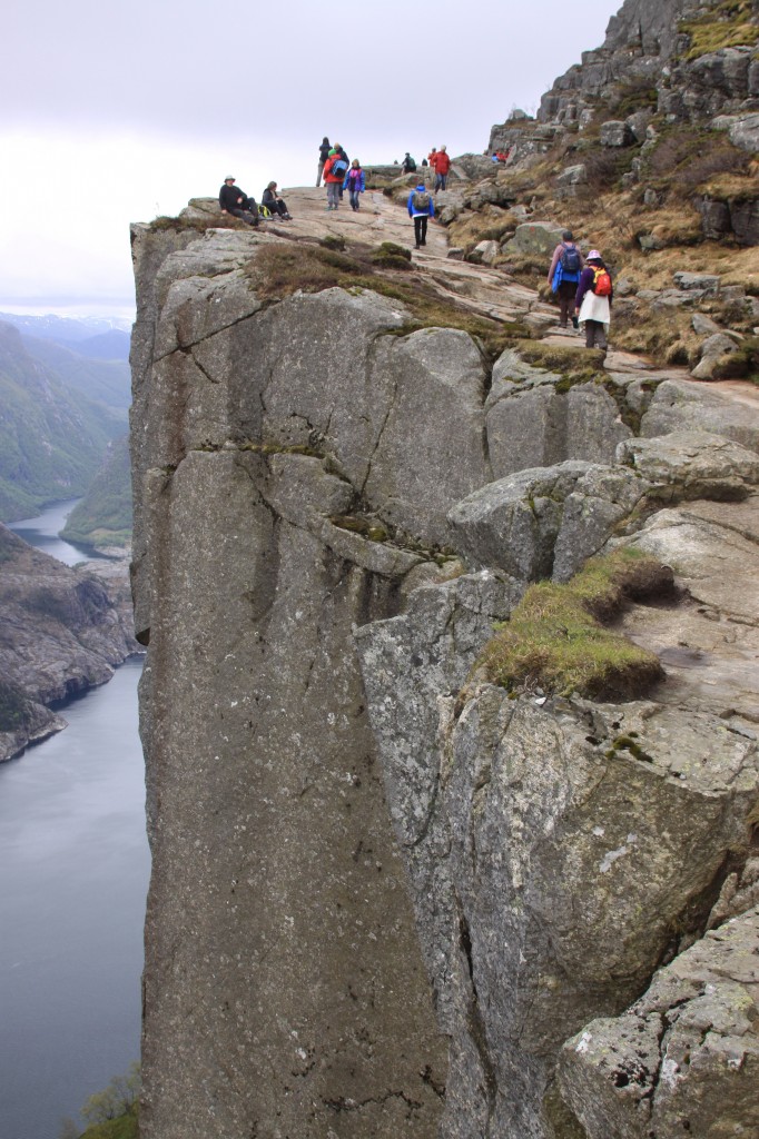 walking along the cliff edge path towards Preikestolen